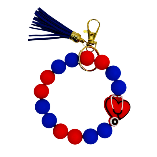 Silicone Beaded Wristlet, Nurse Heart Focal Bead, Royal blue and red wristlet with blue tassel and stethoscope bead