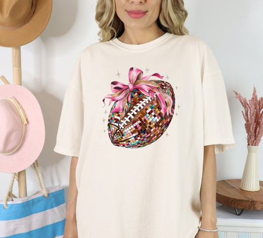 Faux Glitter Football T-shirt on Cream Comfort Colors, Game day Apparel, Coquette football shirt, Sports apparel - KLC by Karelyn D